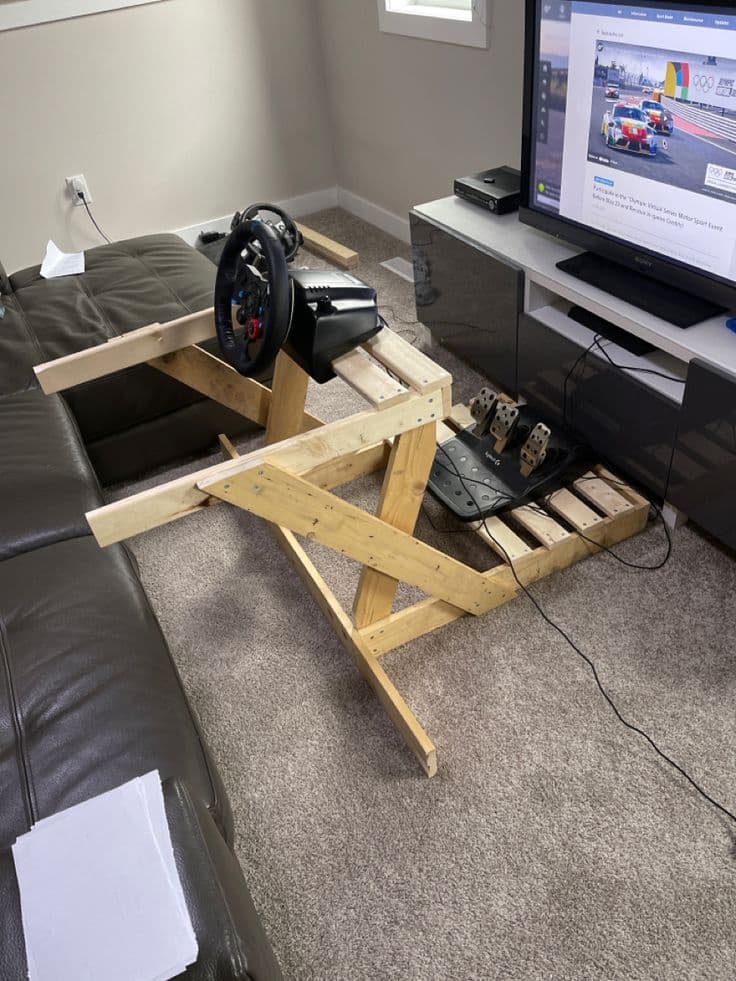 DIY sim racing rig with wheel and screen
